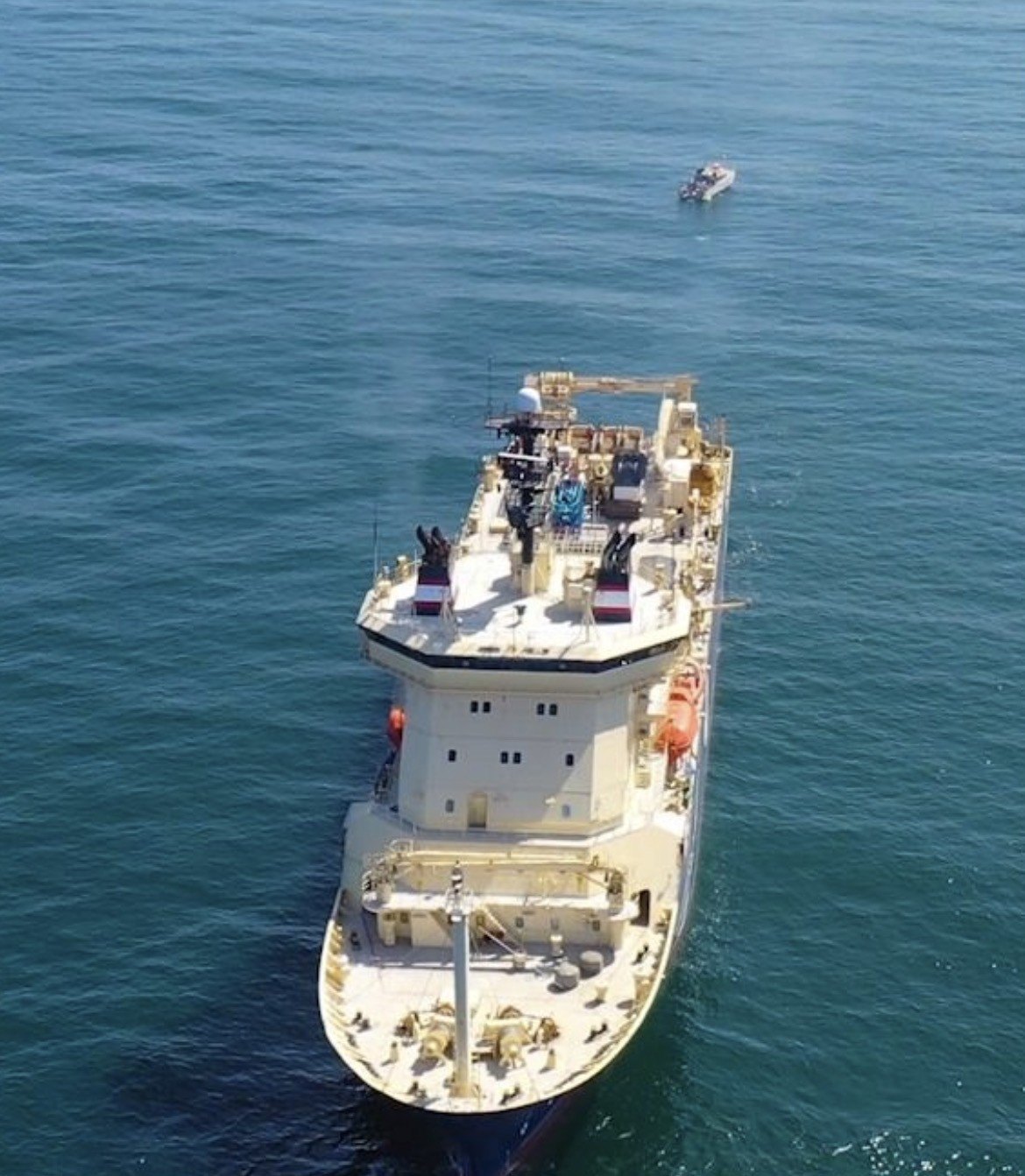 Cable ship and dive vessel on location for shore-end landing operations