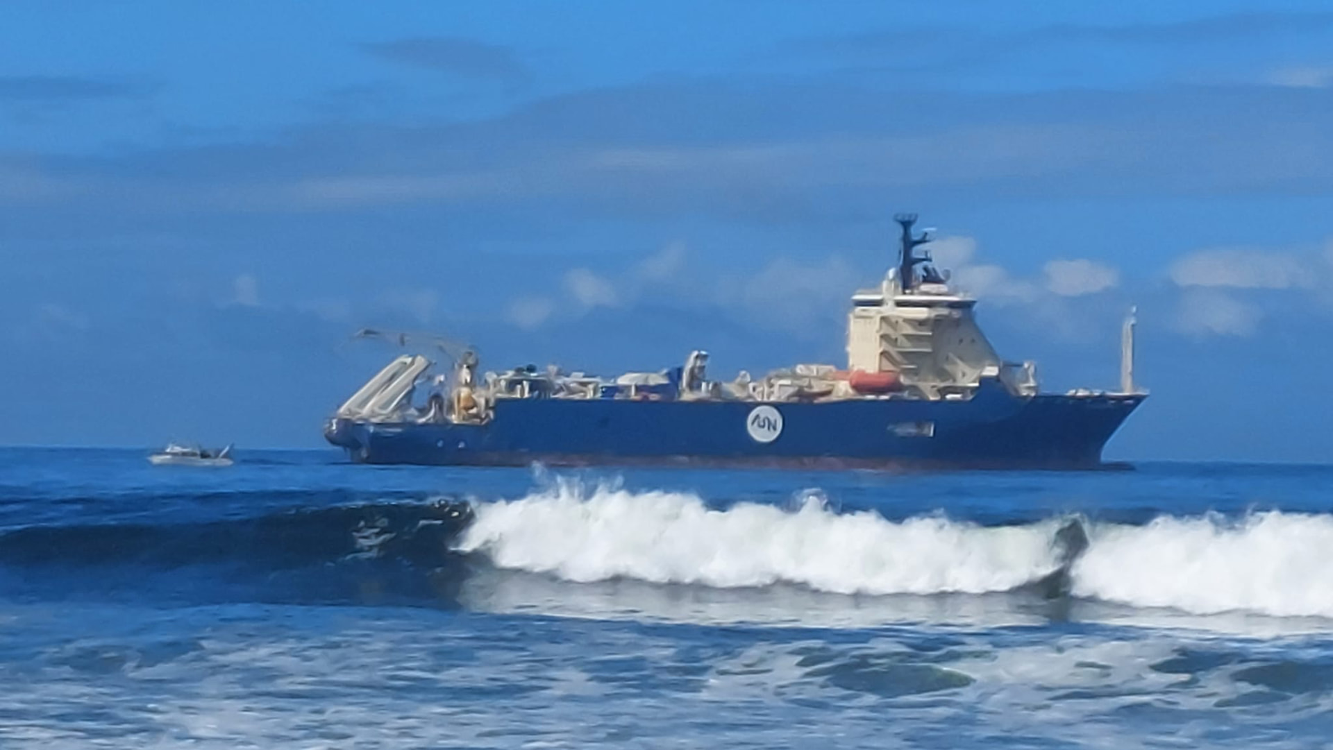Submarine cable ship on station during a shore-end landing